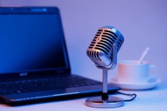 Retro microphone and notebook computer, live webcast on air concept